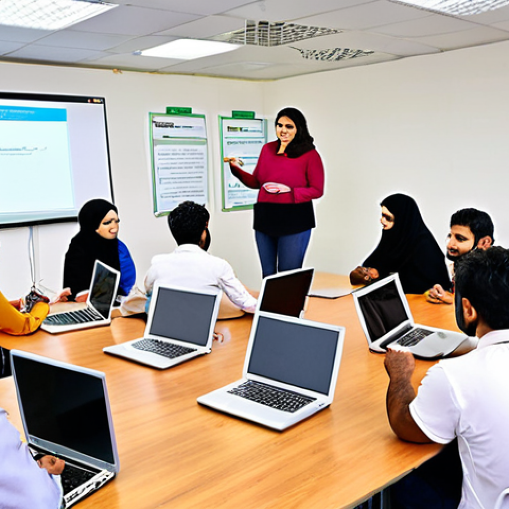 **A diverse group of teachers participating in a workshop, actively learning new teaching techniques using laptops and educational apps. The setting is a brightly lit, modern training room with Urdu text on a whiteboard.**